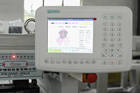 What are the advantages of a hat embroidery machine?